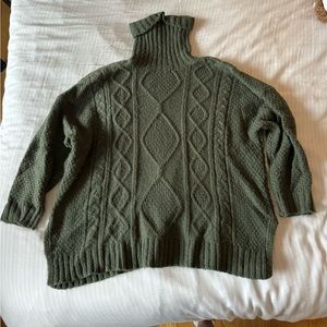 Green turtleneck sweater